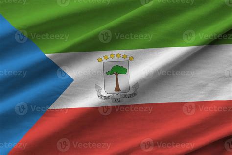 Equatorial Guinea flag with big folds waving close up under the studio
