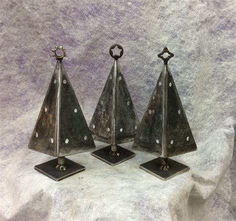 Three Metal Christmas Trees On Top Of Each Other