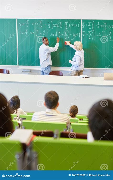 Student And Teacher Writing On Chalkboard Stock Photo Image Of