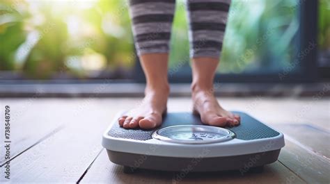 Crop Faceless Barefoot Female Standing At On A Digital Weight And Body