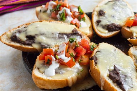 Molletes Vegetarian Mexican Food With Beans And Cheese Stock Photo