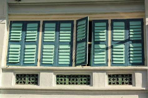 Detail Of Brown Rectangular Wooden Windows Of An Old Vintage Shop House