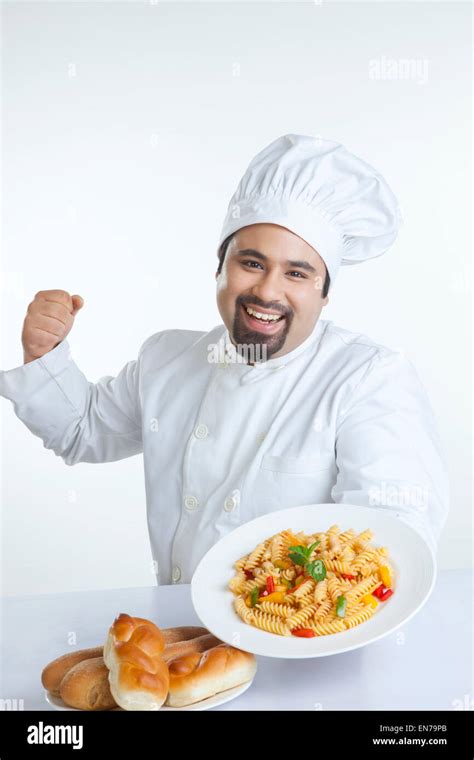 Portrait Of Chef With Plate Of Pasta Stock Photo Alamy