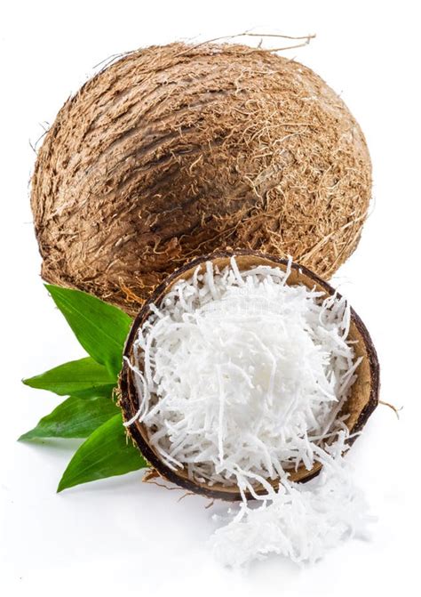 Coconut Fruit And Shredded Coconut Flakes In The Piece Of Shell