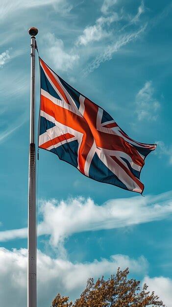 Premium Photo | The British flag waving in the wind UK national flag of ...