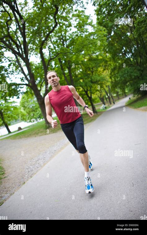 Man Jogging In Park Stock Photo Alamy