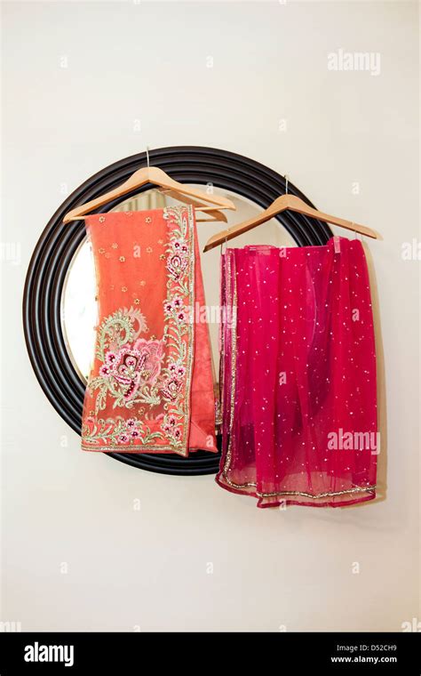 Colorful Fabrics Hanging By Mirror Stock Photo Alamy