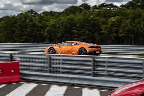 Orange Sports Car Driving Fast on the Highway Editorial Photography ...