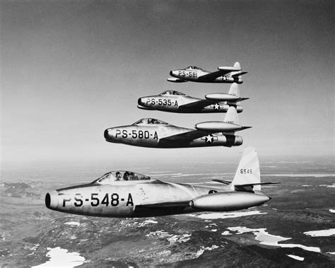 1950s four US air force F-84 thunder jet fighter bomber airplanes in ...