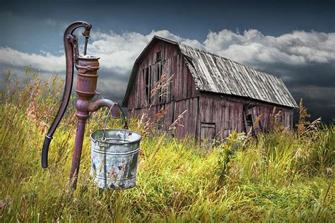 Weathered Wooden Barn With Water Pump And Metal Bucket Photograph By