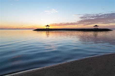 Premium Photo | Sunrise at pantai karang beach in sanur bali indonesia