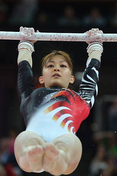 Japan's gymnast Rie Tanaka performs on the uneven bars during the women ...