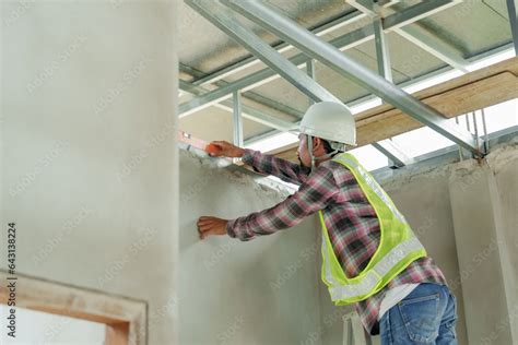 Indian Construction Worker Climb Stairs To The Roof To Pick Up Water