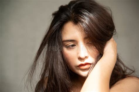 Indoor Portrait Of Asian Amazing Young Freckled Long Haired Female Of