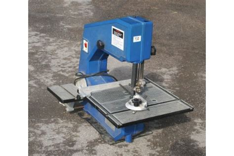 A Nutool Bandsaw With Sanding Attachment