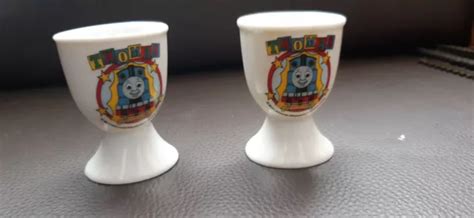 Pair Of Porcelain Thomas The Tank Engine Egg Cups Britt Allcroft