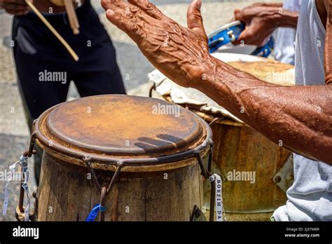 Musicians Playing Traditional Instruments Used In Capoeira A Mix Of