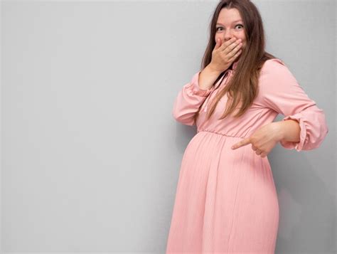 Premium Photo Pregnant Woman Pointing At Pregnancy