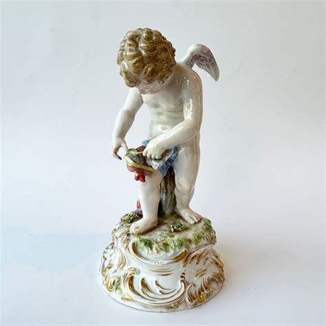 Meissen Porcelain Figure Of Cupid Binding A Heart