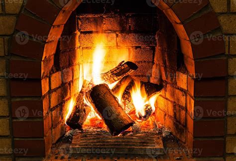 burning wooden logs in fire-box of fireplace 14485161 Stock Photo at Vecteezy