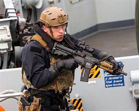 A Royal Marine from 42 Commando carrying out a boarding demonstration ...