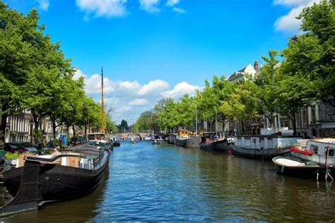 Canals and Embankments with Boats of Amsterdam City. Stock Photo ...