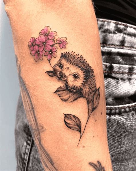 A Hedgehog With Flowers On Its Head Is Shown In This Tattoo Artist S Photo