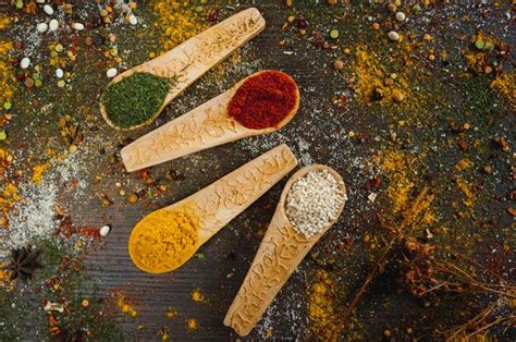 Premium Photo Spices And Herbs In Wooden Spoons