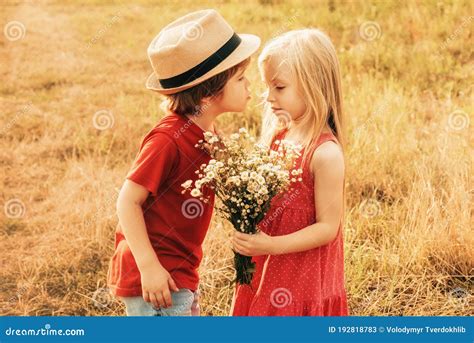 Kids Love Concept Children Having Kiss In Autumn Field Little Couple