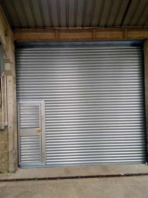 Roller Shutter With Personnel Door Manchester Westwood Security Shutters