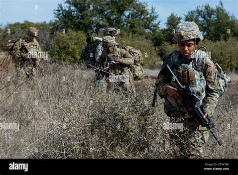 Airmen Assigned To The 3d Weather Squadron Navigate Through Grassland