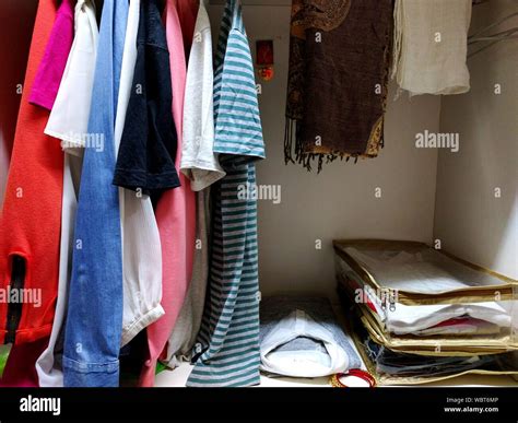 Clothes Hanging In Closet At Home Stock Photo - Alamy