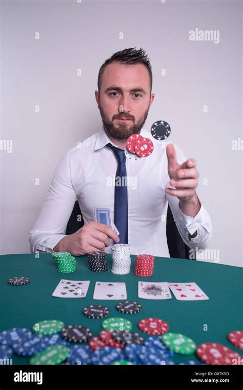 Poker player throwing gambling chips in the air Stock Photo - Alamy