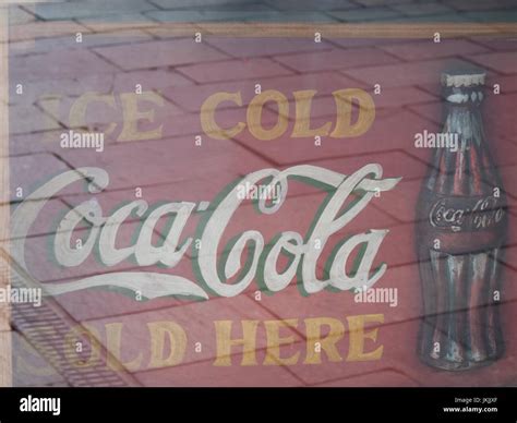 Faded Retro Ice Cold Coca Cola Sold Here Sign In Cafe Window