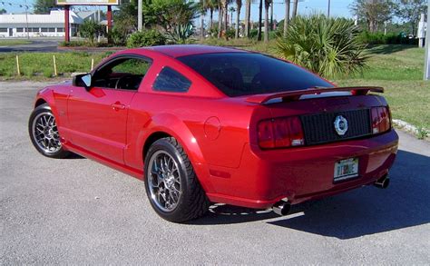 Dark candy apple red 2008 ford mustang shelby gt500