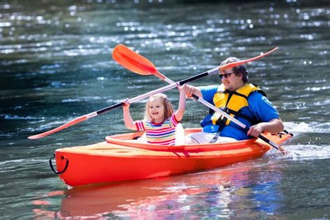 Father And Child Kayaking In Summer Stock Photo Image Of Lake