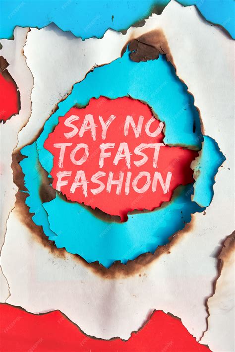 Premium Photo | Text "say no to fast fashion" in hole burned though ...