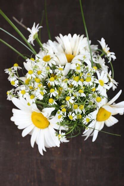 Premium Photo Beautiful Bouquet Of Daisies On Wooden Background