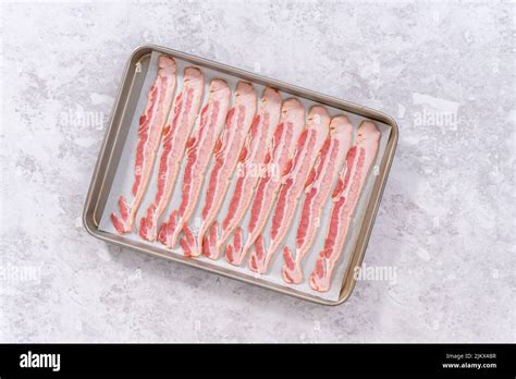 Cooking bacon strips Stock Photo - Alamy