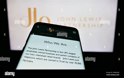 Mobile Phone With Website Of Retail Company John Lewis Partnership Plc