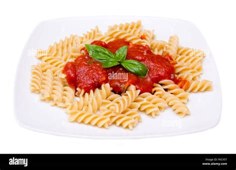 Fusilli with tomato sauce on white background Stock Photo - Alamy