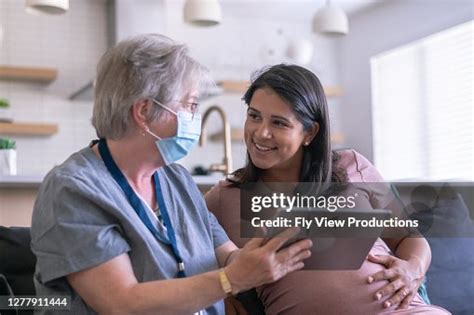 An Ethnic Pregnant Woman Having A Medical Appointment With Her Doctor