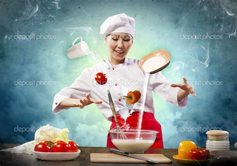 Asian female cooking with magic Stock Photo by ©SergeyNivens 21136949