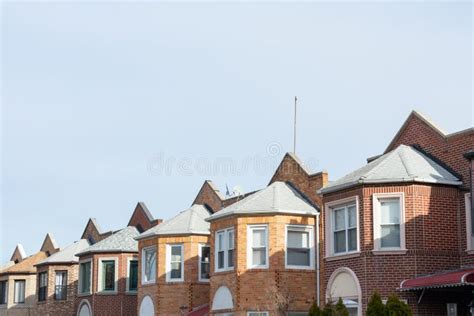 Row Of Similar Old Brick Homes In Astoria Queens New York Stock Image