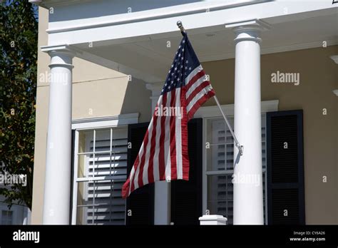 American Flag Flying On The Porch Of An Upmarket House In Florida Usa