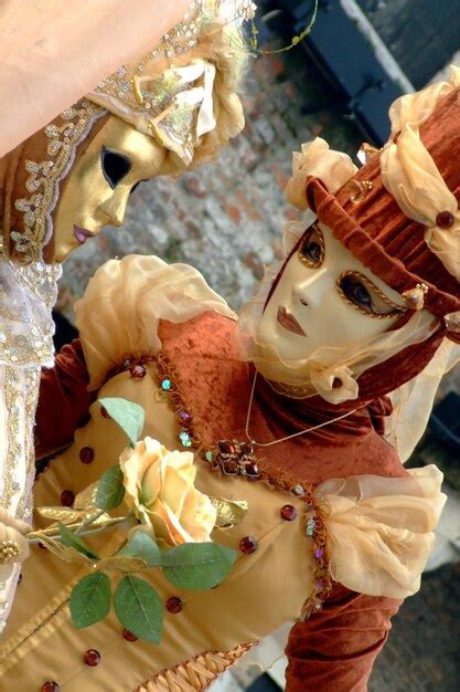 Premium Photo Woman Wearing Mask And Costume During Carnival