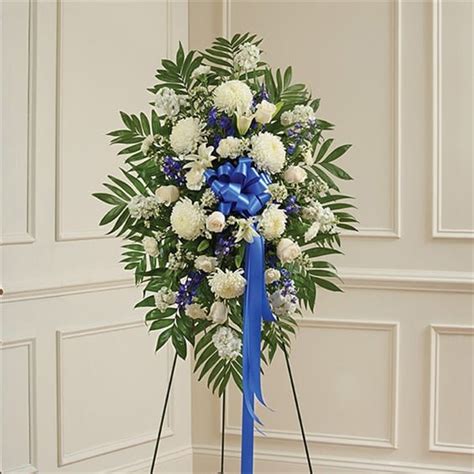 Blue White Sympathy Standing Spray In Suffern Ny Petals And Stems