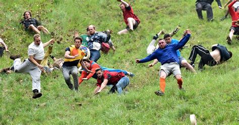 Brockworth hosts its annual cheese rolling contest on Monday, as thousands of people watch ...