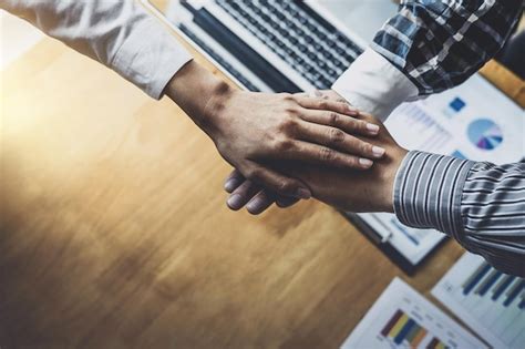 Premium Photo Close Up Of Business People Stacking Hands