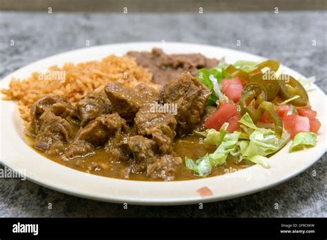 Authentic Mexican Food Plate Of Chili Verde Pork Smothered In Green